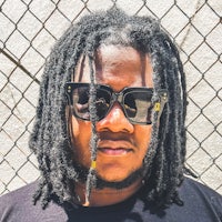 a cartoon of a man with dreadlocks and headphones